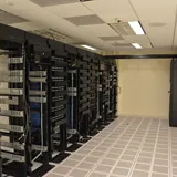 Rows of server racks in a data centre.